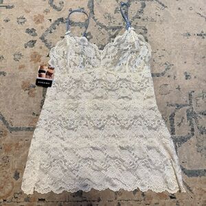 Foxers white lace lingerie. Blue and white polka dot straps . Full length